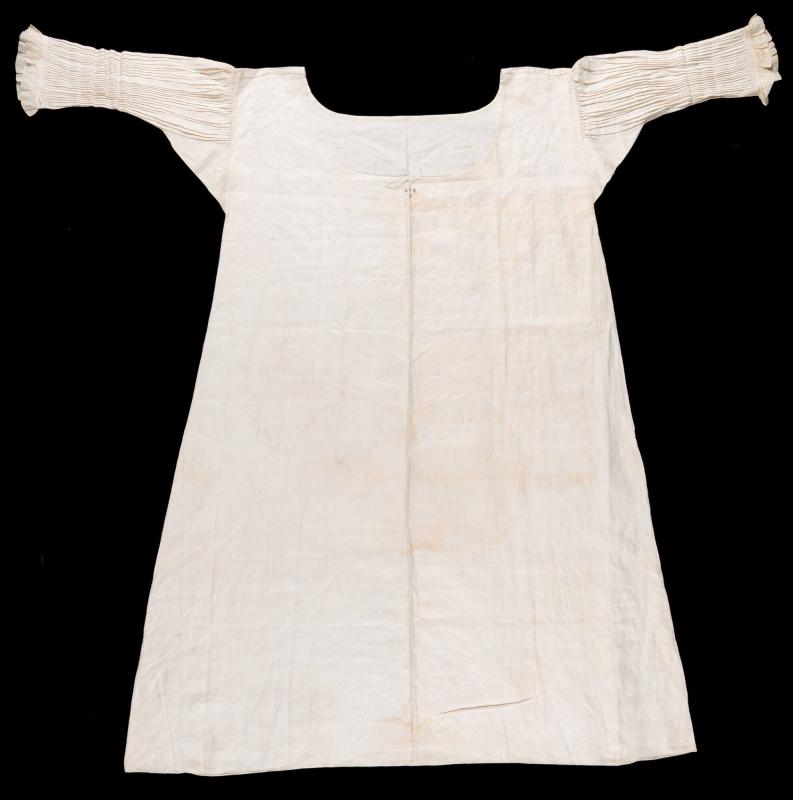 Off-white linen plainweave infant's chemise with drawstring neck